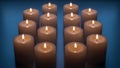 Lighted Candles on Blue Background Royalty Free Stock Photo