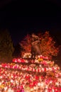 Lighted candles at monument to Victims of the East Golgotha at at All Saints` Day. Monument at Gdansk Lostowice cemetery. Royalty Free Stock Photo