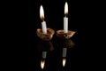 Lighted candles in nutshells Royalty Free Stock Photo