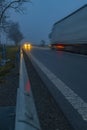 Lighted cars at dusk on  main road Royalty Free Stock Photo