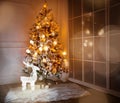 A lighted Christmas tree with presents underneath Royalty Free Stock Photo