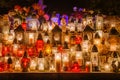 Lighted colorful candles on the feast of the dead, set on the grave of the memory of the deceased Royalty Free Stock Photo