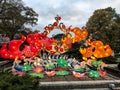 Four Chinese koi fish light display at China Lights in Hales Corner, Wisconsin with hanging red Chinese lanterns Royalty Free Stock Photo