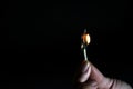 Lighted match in the hands of girls Royalty Free Stock Photo