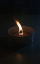 A lighted mosquito candle close-up with a burning wick Royalty Free Stock Photo