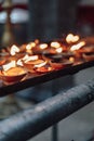 Lighted oil candles for divine`s worship inside Batu Caves near Kuala Lumpur, Malaysia. Royalty Free Stock Photo