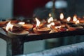 Lighted oil candles for divine`s worship inside Batu Caves near Kuala Lumpur, Malaysia.