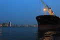 Lighted ship at apapa port, lagos after sunset . CMS is at the background in Lagos Nigeria