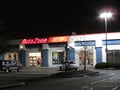 Lighted sign of AutoZone car parts store on Rt 1 in Edison, NJ USA.