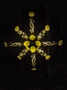 A lighted snowflake in the shape of a star, Beautiful picture of golden fireflies lights. Royalty Free Stock Photo