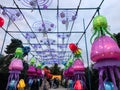 Lighted squids at China Lights show in Hales Corner, Wisconsin with hanging red Chinese lanterns