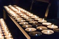 Lighted tea candles in a row Royalty Free Stock Photo