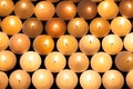 Lighted tealight candlelight background image. Lit flaming candles in rows from above.