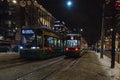 Lighted trams on the streets of Helsinki in winter at night Royalty Free Stock Photo