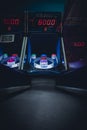 A lighted vintage Skee-Ball game in a darkened arcade Royalty Free Stock Photo