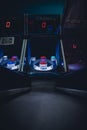 A lighted vintage Skee-Ball game in a darkened arcade Royalty Free Stock Photo