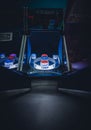 A lighted vintage Skee-Ball game in a darkened arcade Royalty Free Stock Photo