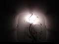 Lighted wall lamp on a dark background