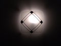 Lighted wall lamp on a dark background