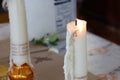 Lighted white candle set in Thai temple, Buddhist concept