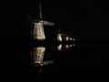 Lighted windmills in the black night Royalty Free Stock Photo