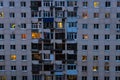 Lighted windows and balconies of an old night residential building Royalty Free Stock Photo