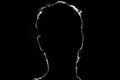 Lighten portrait silhouette of a human head in the dark background