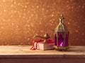 Lightened lantern and book on wooden table Royalty Free Stock Photo