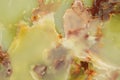 Lightened slices marble onyx. Horizontal image. Warm green colors. Beautiful close up background