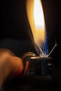 A Lighter Being Lit in the Dark Royalty Free Stock Photo