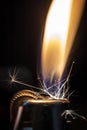 A Lighter Being Lit in the Dark Royalty Free Stock Photo