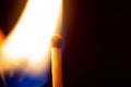 Lighter flame getting close to fire o matchstick Royalty Free Stock Photo