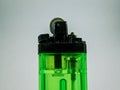 A lighter made of plastic, green color. dead matches can& x27;t be used