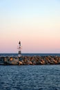 Lighthouse in the Aegean Sea in sunset. Royalty Free Stock Photo