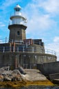 Lighthouse against a blue sky Royalty Free Stock Photo