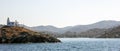 Lighthouse and agios Nikolaos church. Kea,Tzia island, Greece. Sky background, banner. Royalty Free Stock Photo