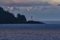 Lighthouse and Alaskan Mountain Range