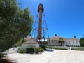 Lighthouse in an area of small houses and greenery on a sunny day in Sanibel island Royalty Free Stock Photo