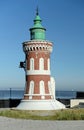 Lighthouse on the background of the sea