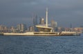 Lighthouse in the Baku Bay against the background of high-rise buildings under construction. Azerbaijan Royalty Free Stock Photo