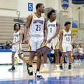 Lighthouse basketball players playing on a field at the competition