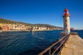 Lighthouse in Bastia harbour with Joannis Babtistes Cathedral