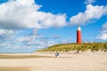 Lighthouse and beach of De Cocksdorp on Texel island, Netherlands