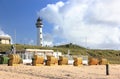 Lighthouse and beach in Egmond aan Zee. North Sea, the Netherlands.