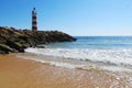 Lighthouse on the beach in Faro, Portugal Royalty Free Stock Photo