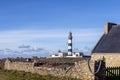 Lighthouse and Beacon of Ouessant, the island of Ushant, in Brittany, french rocky beach in northern France, Finistere Royalty Free Stock Photo