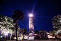 Lighthouse beams emitting against the night sky Royalty Free Stock Photo