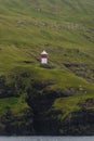 Lighthouse at beautiful Faeroe islands, summer time Royalty Free Stock Photo