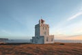 lighthouse at beautiful icelandic seacoast at sunny day, vik dyrholaey, reynisfjara