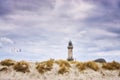 Lighthouse behind the dunes in WarnemÃÂ¼nde Royalty Free Stock Photo
